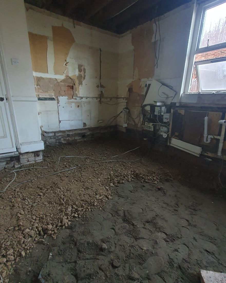 The floor dug out down to the ground beneath, with the walls hacked back