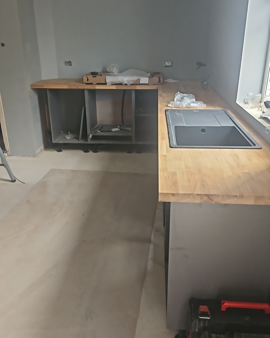 New kitchen base units going in with an oak worktop on top, the floor protected